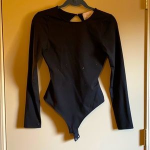 Blush boutique open back bodysuit!